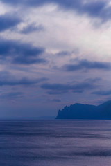 seascape with cliffs in the late evening