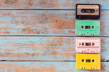 Top view (above) shot of retro tape cassette on wood table - vintage pastel color effect styles