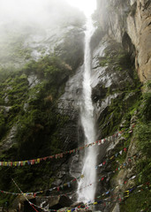 Long waterfall in the middle of mountain path, Bhutan