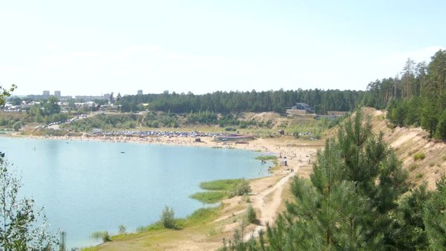 Lake beach in forest. View from top