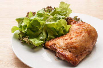 homemade grilled chicken and salad on wooden table