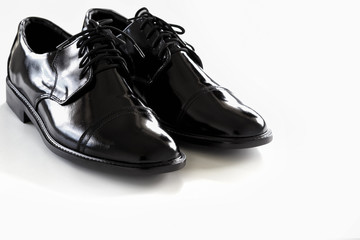 black leather shoes on a white background