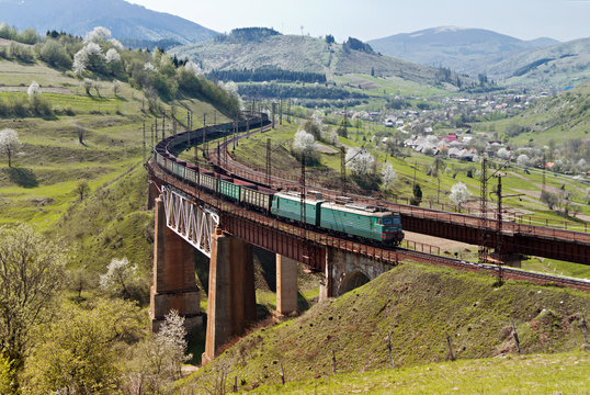 Train on the railway bridge in Carpathian mountains, Ukraine