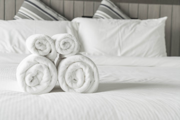 White towel on bed decoration in bedroom interior