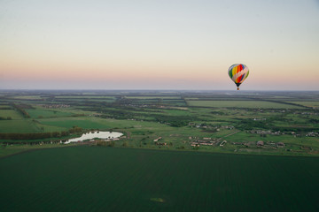 Balloon on a background of the beautiful green landscape