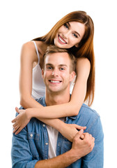 Portrait of young happy hugging couple, on white