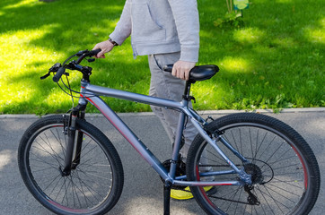 Fototapeta na wymiar Young man with bicycle