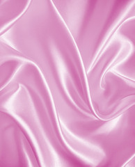 Smooth elegant pink silk or satin texture as background