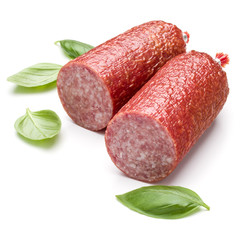 Salami smoked sausage and basil leaves isolated on white backgro
