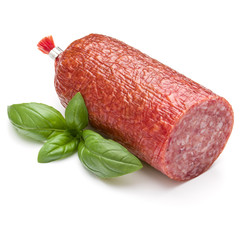 Salami smoked sausage and basil leaves isolated on white backgro