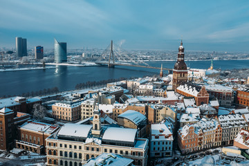 Obraz premium View from tower of St. Peters Church on Riga Cathedral and roofs of old houses in old city of Riga, Latvia