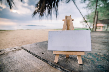 conceptual image blank white canvas and wooden easel under cotta