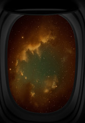 Window view of space with nebula and stars.