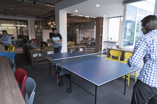 playing ping pong tennis at creative office space