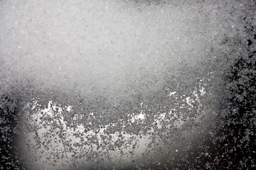 Salt sprinkled on a glass table