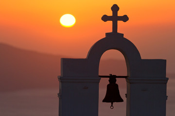 Famous church in Fira, Santorini shot at sunset