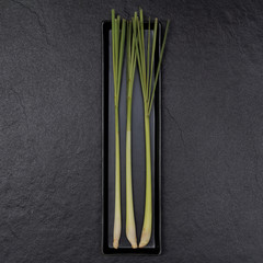 Lemongrass in a rectangular plate with dark background