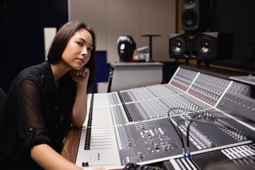 Female student using sound mixer