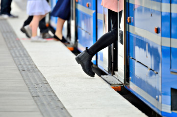 Woman entering tram © connel_design