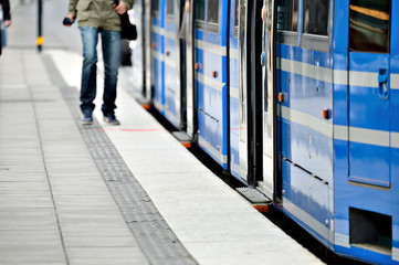 Man running to enter tram