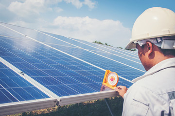engineer or electrician working on  maintenance equipment at industry solar power