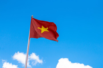Flag of Vietnam with blue sky.