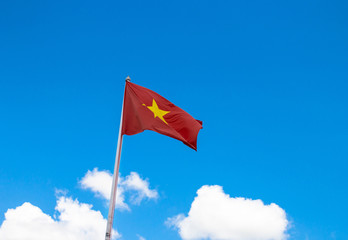 Flag of Vietnam with blue sky.