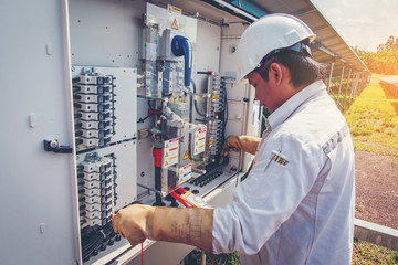 engineer or electrician working on  maintenance equipment at industry solar power