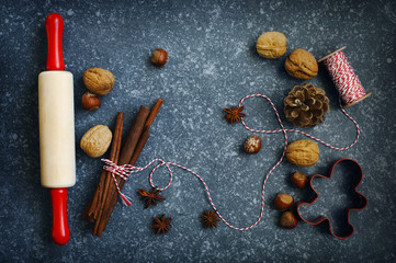 Ingredients for Christmas baking dark background for copy space.