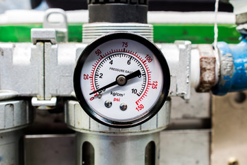 The pressure gauge, in the pneumatic system.