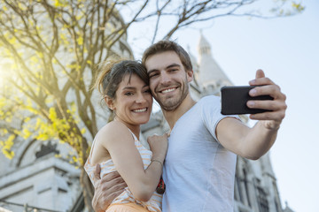 Young couple doing selfie at Montmartre