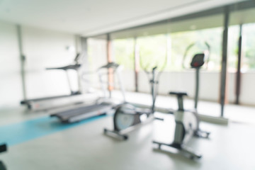 Fototapeta na wymiar Abstract blur fitness gym room interior background