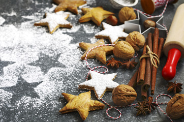 Christmas cookies, roller pin, cinnamon, nuts and cookie cutter o