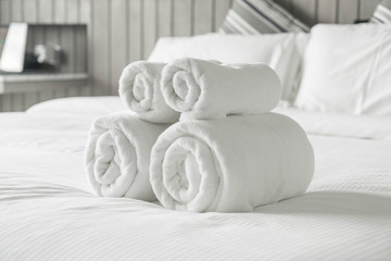 White towel on bed decoration in bedroom interior