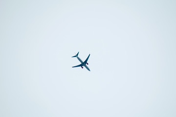 aeroplane flying on white sky background