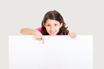Cute girl showing blank white board