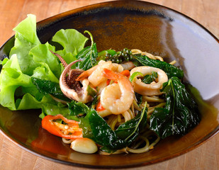 Spaghetti seafood with chili & basil leaf