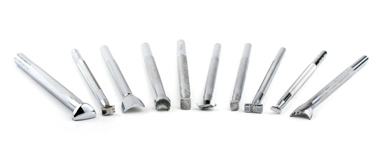Tools for leather stamping, on white