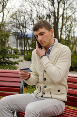 Young man is talking on the phone