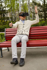 Young man in virtual glasses