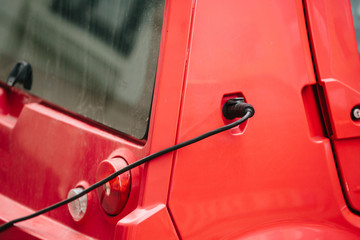 Vehicle with an electric motor. Electric vehicle charging. Eco car.