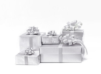 Celebration silver gift boxes on white background