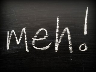 The word Meh written on a blackboard in white chalk as an expression of boredom or indifference when giving an opinion