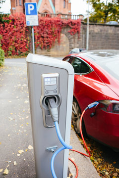 Vehicle with an electric motor. Electric vehicle charging. Eco car.