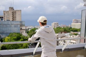 Young man is resting on the roof