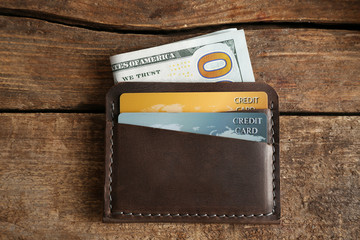 Leather wallet on wooden background