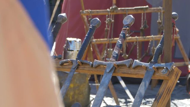 Deadly heavy swords in the sun.