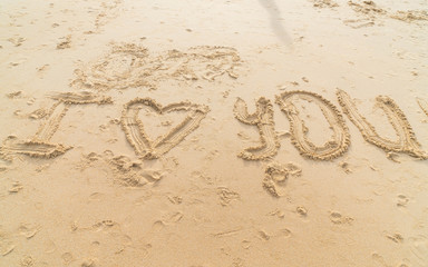 Message i love you on the sand