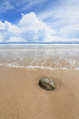 Waves sand beach and clouds sunny day