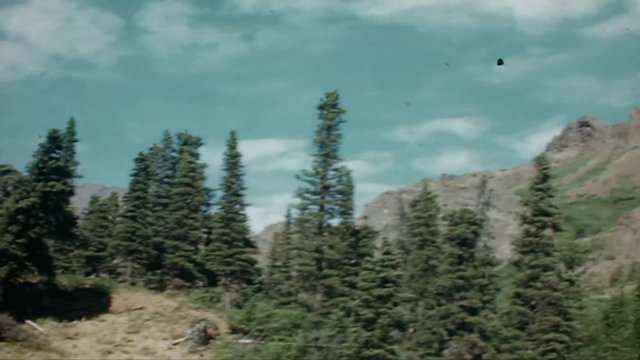 Home Movie 105: Retro 8mm home movie of a mountain and lake.